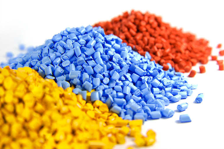 Piles of plastic resin grind in three colors